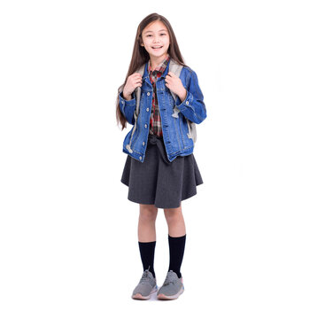 Full length portrait of a smiling girl student with backpack standing on white background