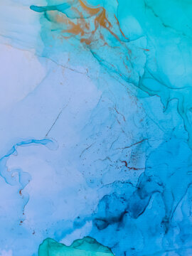 Background texture of alcohol ink in blue color. Abstract paint with drops and stains. © Galina