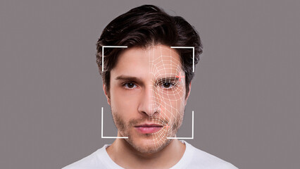Young man experiencing face scanning, face id - obrazy, fototapety, plakaty
