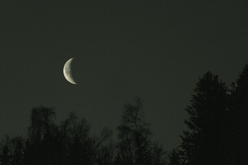 The half moon above Olterudelva Valley, Toten, Norway.