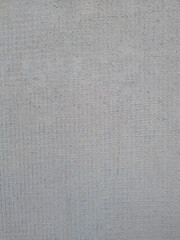 Background cement sand plaster with blue reinforcing mesh