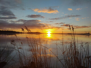 Spectacular sunset over  frozen lake in the Sweden in winter