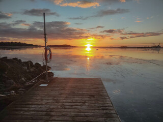 Spectacular sunset over  frozen lake in the Sweden in winter