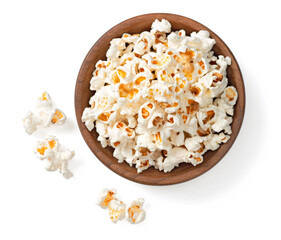 Popcorn in the wooden bowl, isolated on white background, top view. - obrazy, fototapety, plakaty