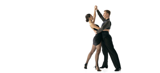 Flyer with young couple of dancers dancing Argentine tango isolated on white studio background. Artists in black stage costumes