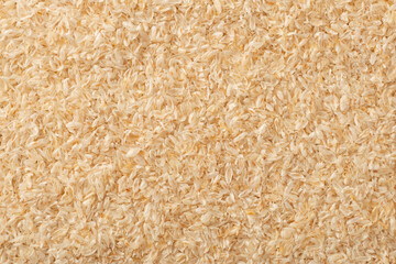 Full frame food background of whole psyllium husk, top view.