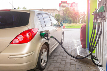 Refueling the car with diesel at a gas station. Car refueling on petrol station. Fuel pump at station. Car trip.