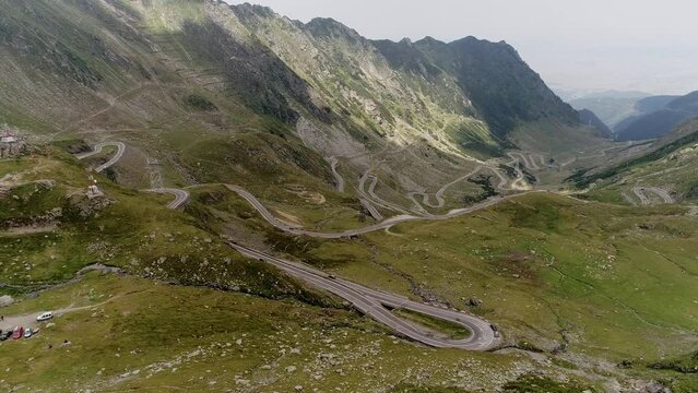 Aerial footage of Fagaras mountain in Romania at Bilea Lake on a cloudy day