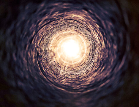 Light at the end of the cave.Bright light at the end of a dark tunnel.