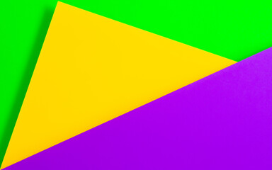 Three colors of paper with its texture as a copy space background for the Mardi Gras carnival