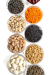 Lentils, legumes and beans on white surface
