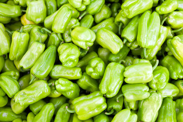Obraz na płótnie Canvas Ripe Fresh Pile Of Green Bell Peppers in Food Bazaar