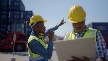 Africa America worker open check container working in the port