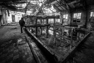 Fototapeta na wymiar man on abandoned and ruined factory