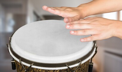 Fototapeta na wymiar Hands of a musician playing percussion in presentation, music concept