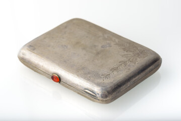 Old metal cigarette case on a white background. Isolated image
