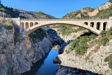 Fototapeta na wymiar survol du pont du diable près de saint Guilhem le désert en Occitanie dans le sud de la France