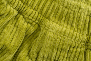 Yellow - green fabric velvet texture close up