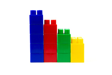 Obraz premium colorful wall-built building blocks isolated on white background. close-up