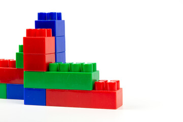 colorful wall-built building blocks isolated on white background. close-up