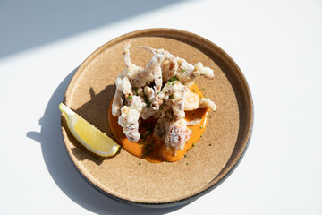 Soft shell crab calamari served with lemon and spicy sauce