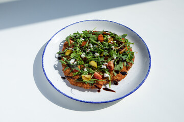 Chicken Milanese served in a round plate on 