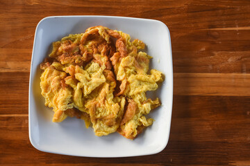 Omelet on a black plate on the table