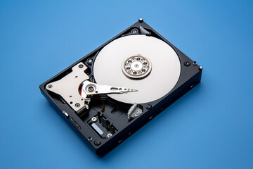 Hard disk drive and open cover. Computer hardware, hard disk, storage device. Detail of the inside...