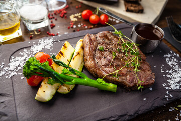 Black Angus New York steak. Marbled beef sirloin from Uruguay. Delicious healthy traditional food closeup served for lunch in modern gourmet cuisine restaurant