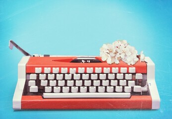 Old retro Typewriter and fresh flowers