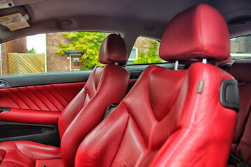 Red leather seats in luxury car