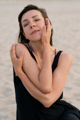 Portrait of a woman with hands near her face