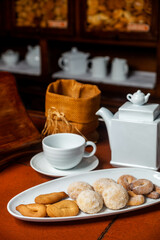 A platter with dry cakes, on the counter of a traditional bakery.