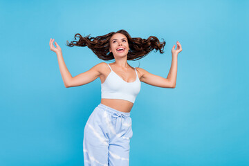 Photo of tender pretty lady throw curly hairdo enjoy shampoo wear white top isolated blue color background