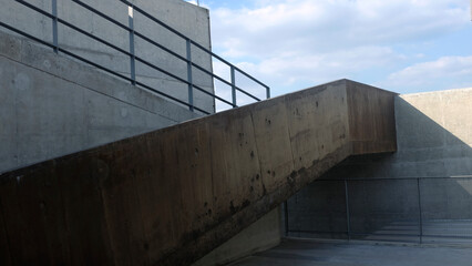 Empty concrete floor for car park. abstract gray building with clear sky background.