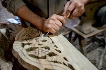 Carve wood Close-up. Hands of craftsmen carve with a hollow in hand on carpentry workbench