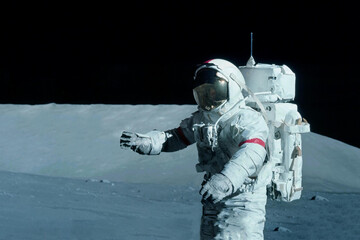 Astronaut on the moon, with galactic background. Elements of this image were furnished by NASA.