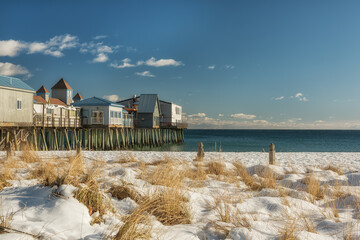 Winter view of the ocean coast with an old pier and colorful wooden houses on the pier. USA. Maine. portland.