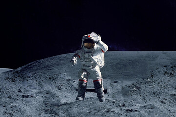 Astronaut on the moon, with galactic background. Elements of this image were furnished by NASA.