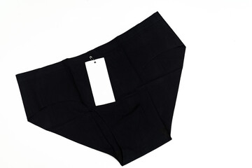 Black women's seamless underpants with a label on a white background. Women's comfortable underwear store.