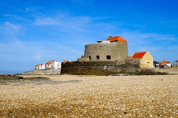 Fort Mahon and promenade with houses of Ambleteuse at low tide, sea fortress as a landmark on the...