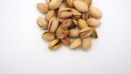 Pistachios on white background.It's roasted dried green nut or shell  close up  top view healthy snack  .