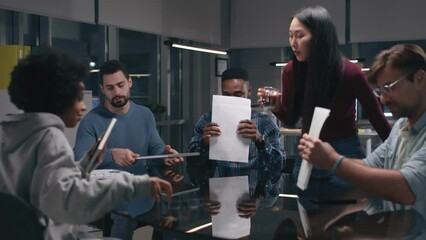 Multiethnic team finish board meeting and leaving