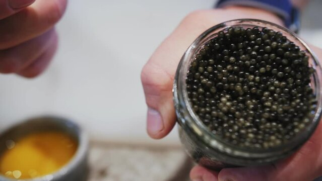 open can of black caviar