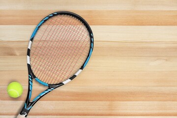 New professional tennis racket and ball on background. Sport theme