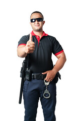 A security guard dressed in black, wearing black glasses, stands up straight and gives a thumbs up. Includes rubber batons, handcuffs, tactical belts Isolated white background.Cut out. Safety concept.
