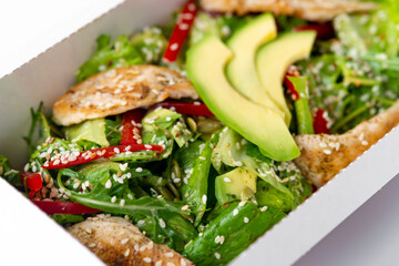 Healthy chicken salad with avocado,in package for take away or food delivery.