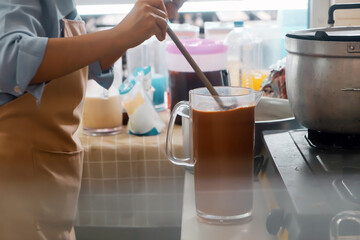 Close up Image of Woman preparing food at the stove