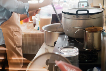 Close up Image of Woman preparing food at the stove
