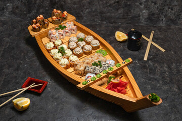 Large Japanese set of rolls with rice and fish, photo for the menu, soy sauce